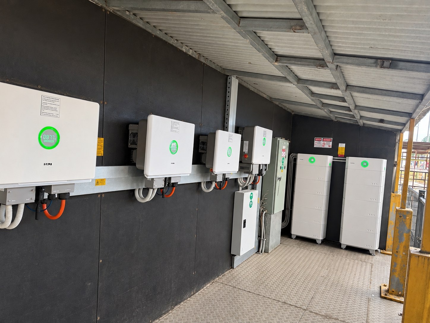 Inverters, battery stacks and switchgear in a commercial plant room