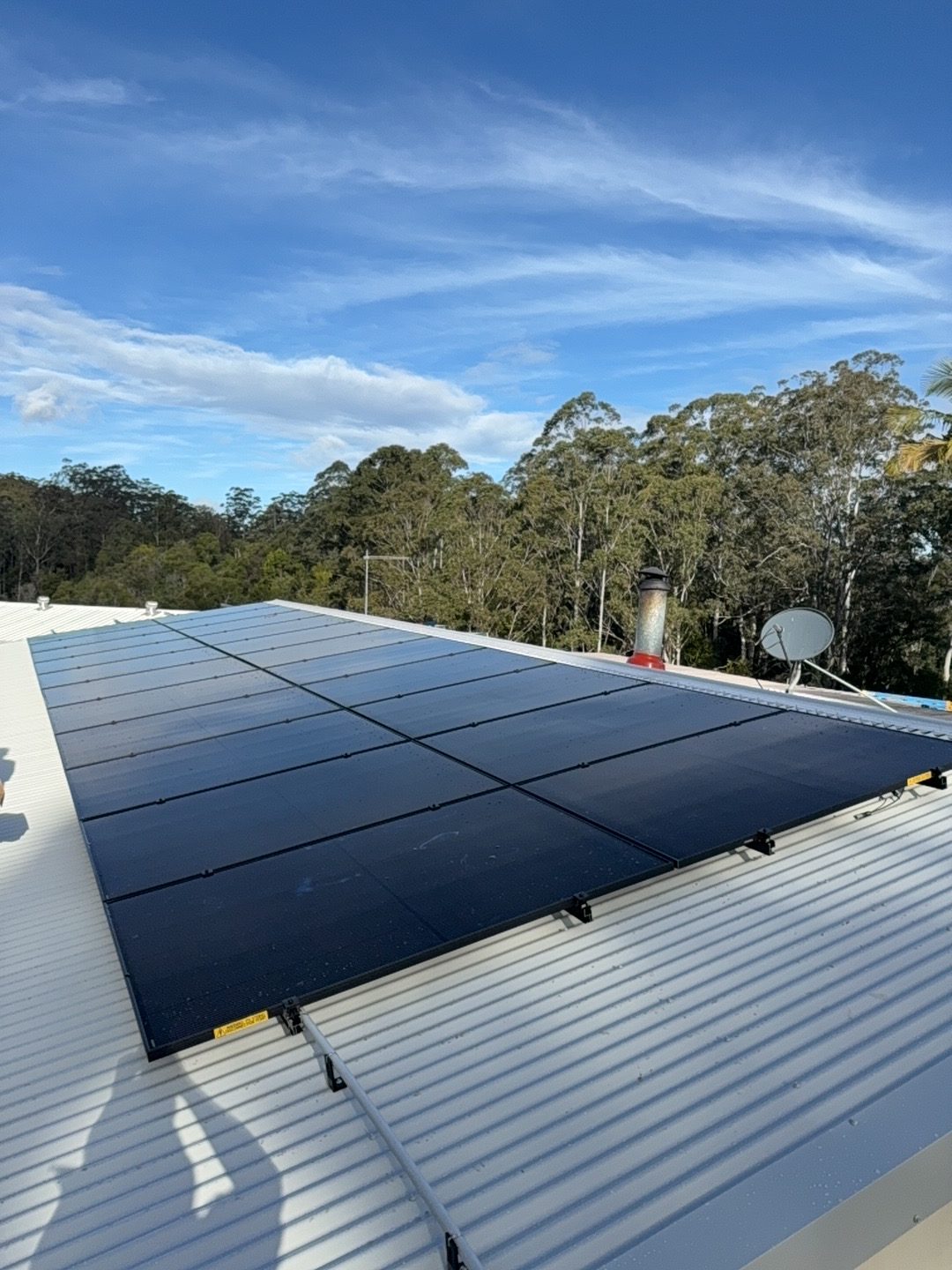 Black Trina panels on a white Colorbond roof at Moonee Estate