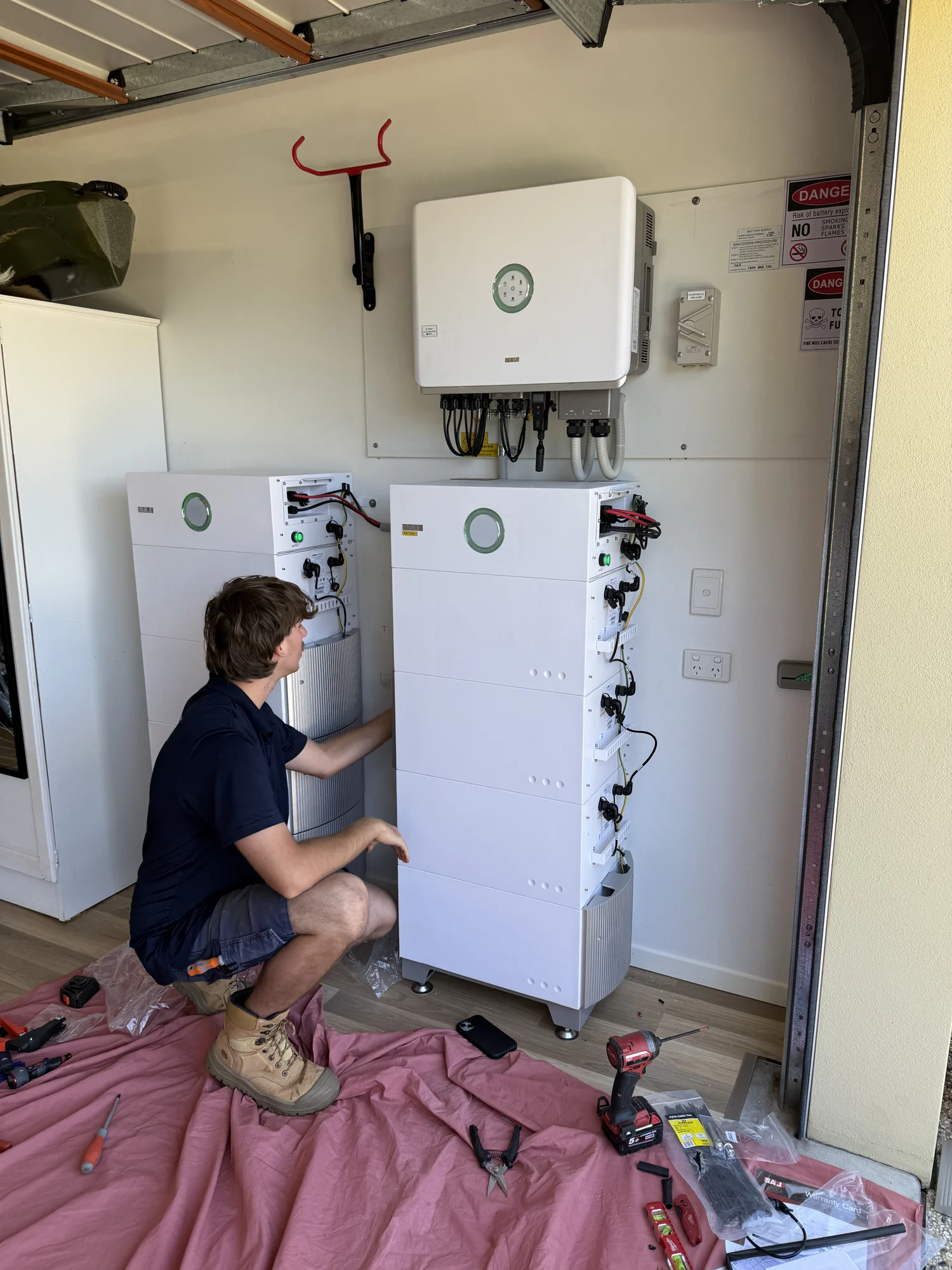 Coffs Coast Electrical installer working on a home battery system